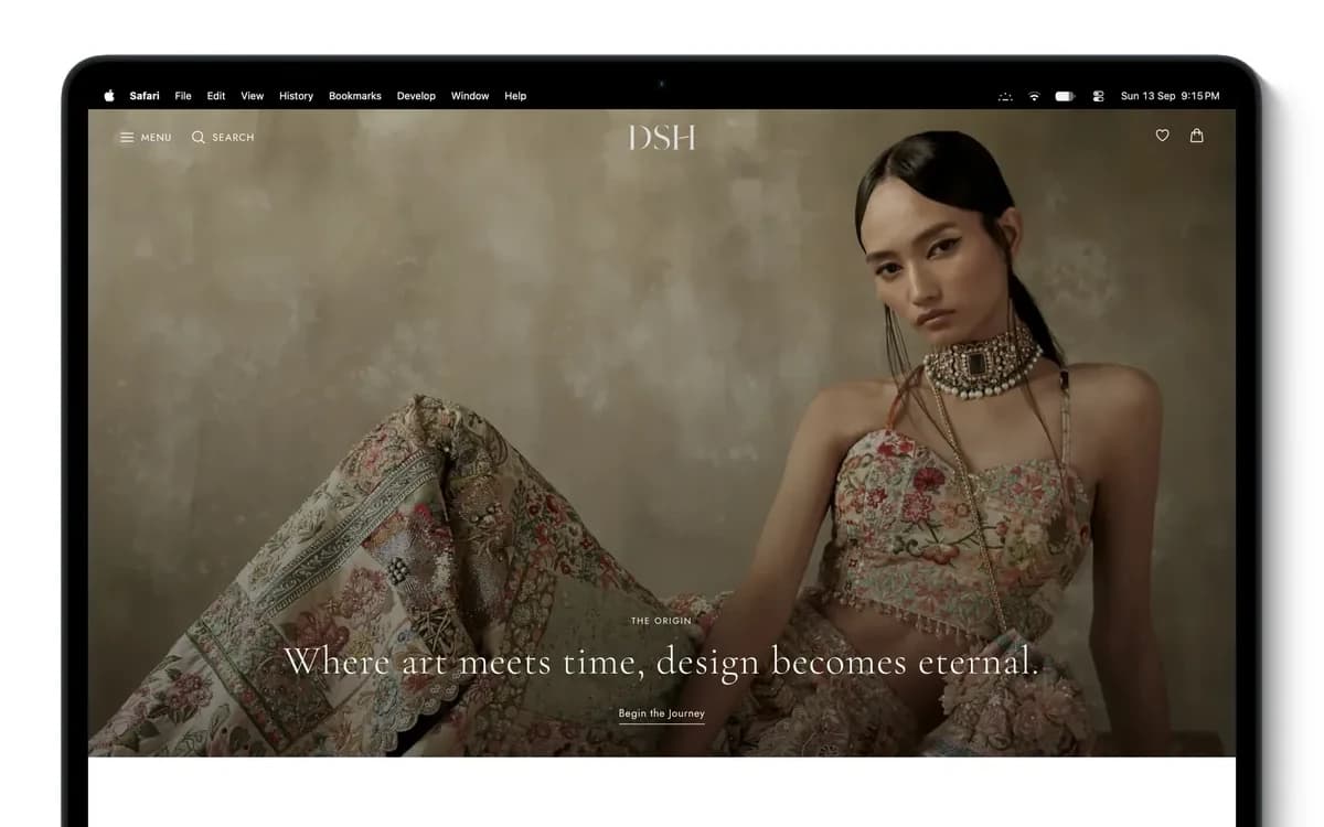 Designer Stock House fashion storefront on a laptop, showing an editorial campaign image